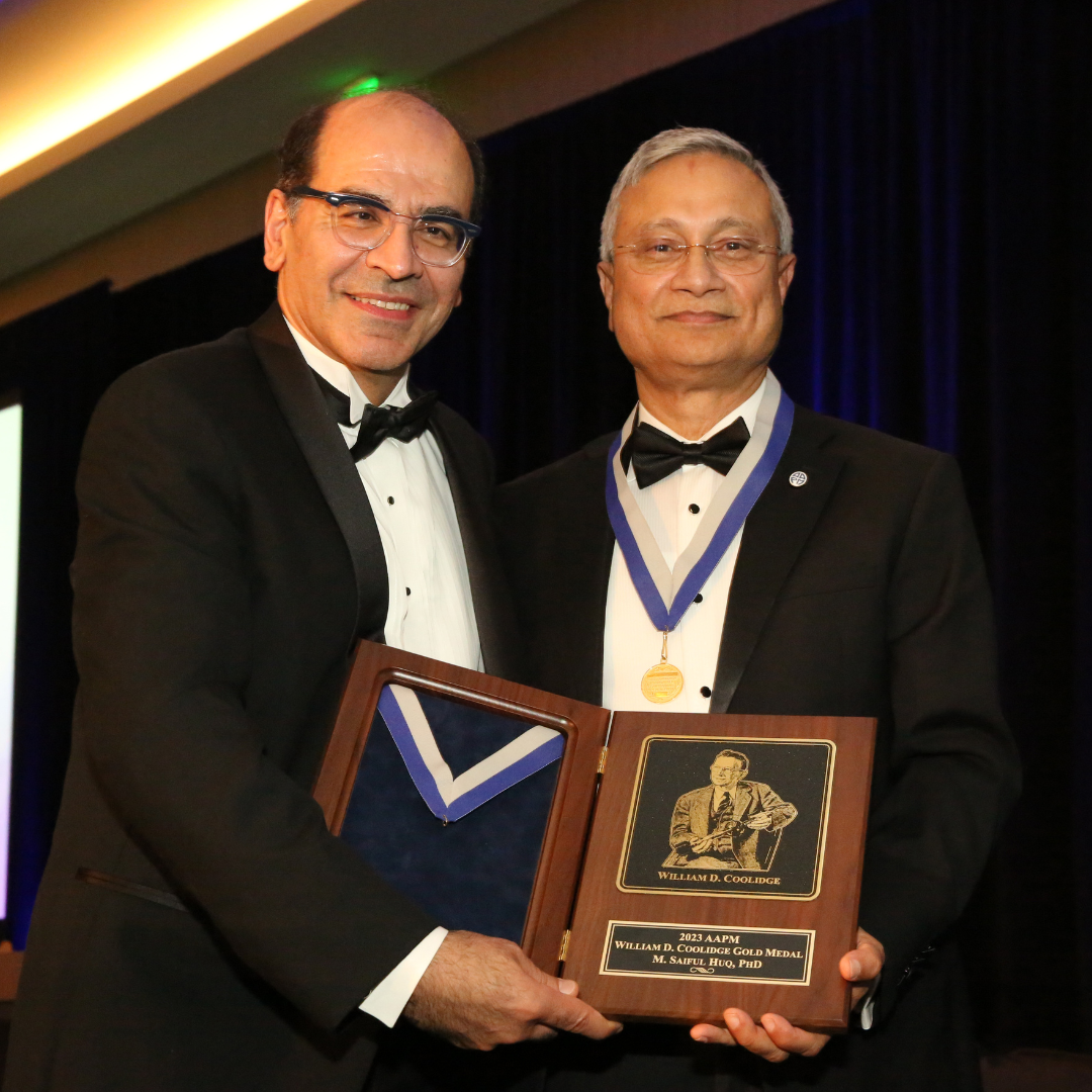 AAPM President Dr. Ehsan Samei presents the William D. Coolidge Award to Dr. Saiful Huq.